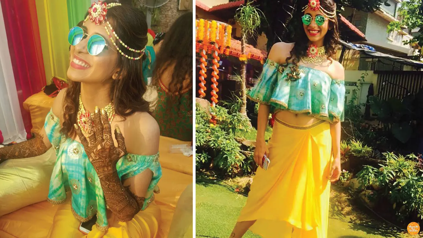 Kishwer merchant wore neon colored wrap around skirt with dhoti like pleats at her mehendi.
