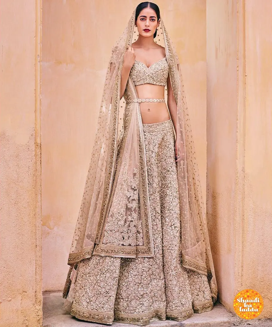 bridal lehenga with heavy work of sequin and lace work with a net choli