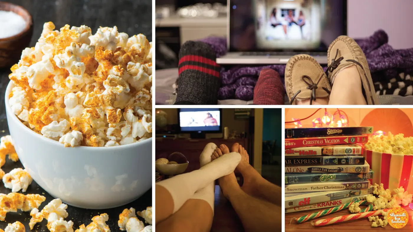 Couple watching movies together at home with popcorns