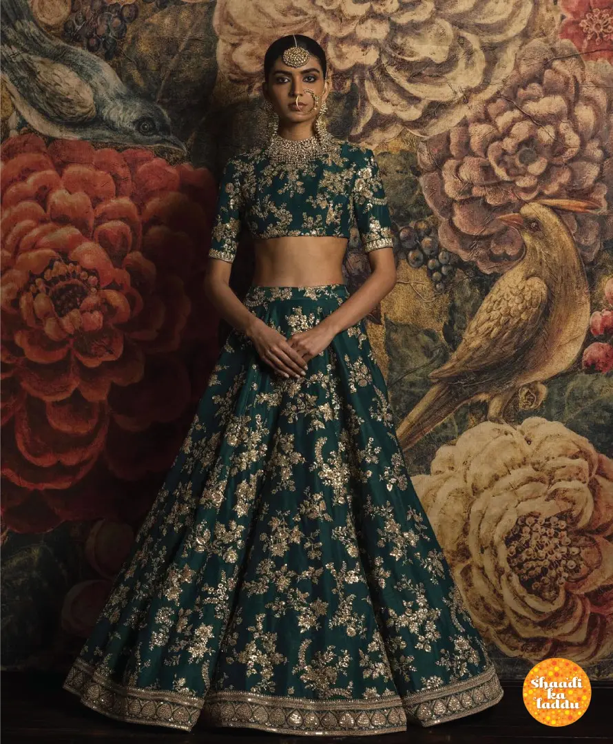 emerald green lehenga.