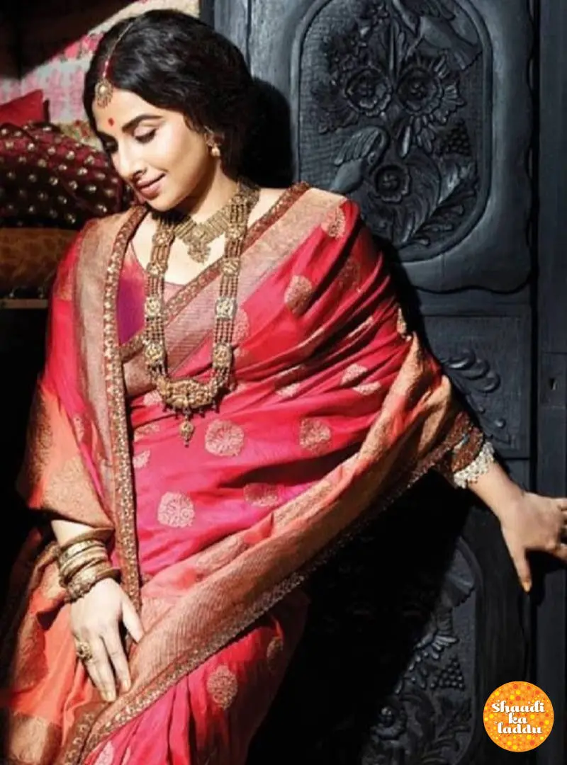 Traditional red Benarasi saree with golden thread work